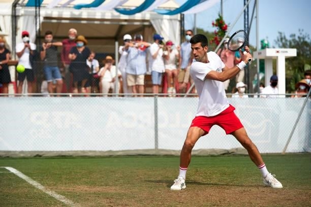Novak Djokovic of Serbia returns a ball during a training session on day two of the Mallorca Championships 2021 at Country Club de Santa Ponça on...