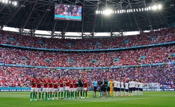 Teams line up as a 'Sign For An Equal Game' message is displayed on the perimeter boards prior to the UEFA Euro 2020 Championship Group F match...