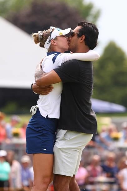 Nelly Korda celebrates with her boyfriend, professional hockey player, Andreas Athanasiou after winning the Meijer LPGA Classic for Simply Give at...