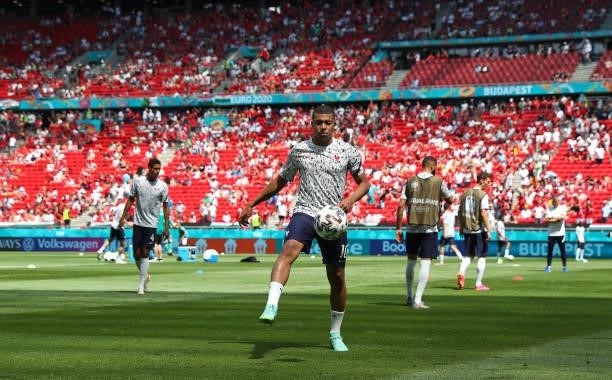 Kylian Mbappe of France warms up prior to the UEFA Euro 2020 Championship Group F match between Hungary and France at Puskas Arena on June 19, 2021...