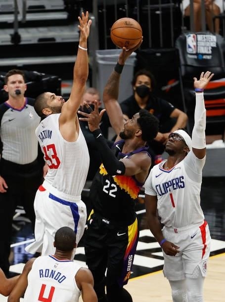 Deandre Ayton of the Phoenix Suns attempts a shot against Nicolas Batum of the LA Clippers during the second half of game one of the Western...