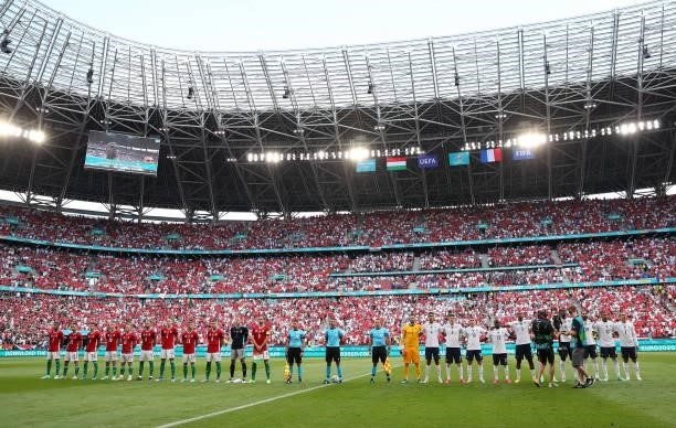 Both teams stand for the national anthem prior to the UEFA Euro 2020 Championship Group F match between Hungary and France at Puskas Arena on June...