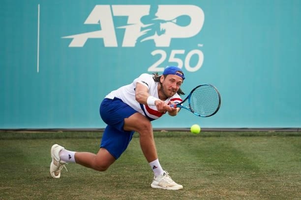 Lucas Pouille of France returns a ball during his Second Round Qualifying match against Pedro Souza of Portugal on day two of the Mallorca...