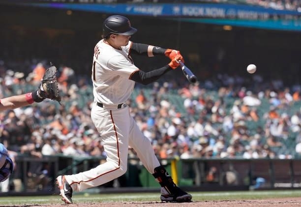 Wilmer Flores of the San Francisco Giants hits a single against the Philadelphia Phillies in the bottom of the seventh inning at Oracle Park on June...