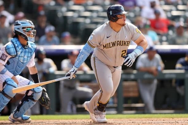 Daniel Vogelbach of the Milwaukee Brewers hits a RBI single against the Colorado Rockies in the ninth inning at Coors Field on June 20, 2021 in...