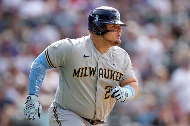 Daniel Vogelbach of the Milwaukee Brewers hits a RBI single against the Colorado Rockies in the ninth inning at Coors Field on June 20, 2021 in...