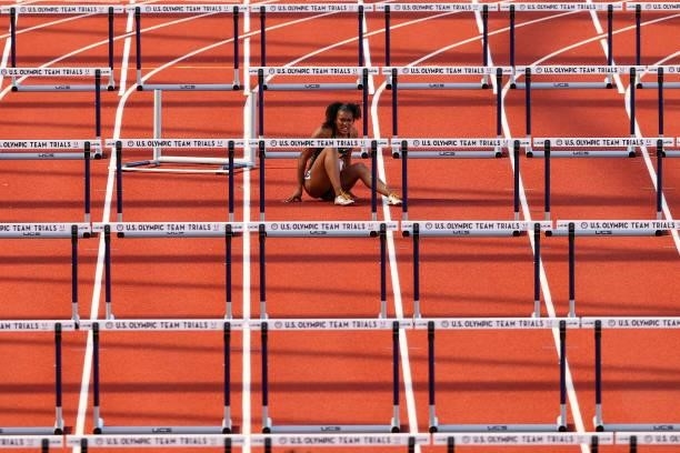 Tia Jones reacts after falling as she competes in the first round of Women's 100 Meter Hurdles on day 2 of the 2020 U.S. Olympic Track & Field Team...