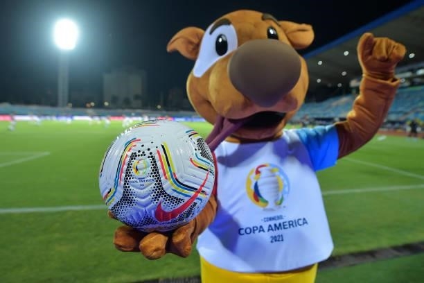 The mascot of Copa America 'Pibe' poses with a match ball before a group b match between Colombia and Peru as part of Copa America Brazil 2021 at...