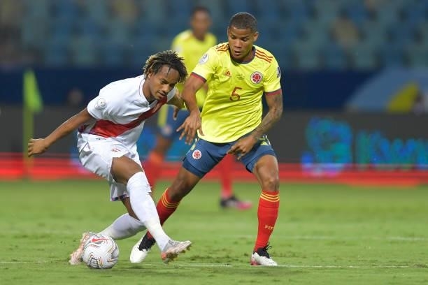 André Carrillo of Peru competes for the ball with Wilmar Barrios of Colombia during a group b match between Colombia and Peru as part of Copa America...