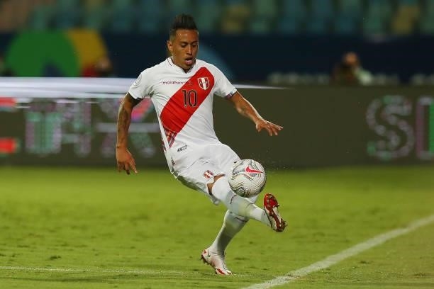 Christian Cueva of Peru controls the ball during a group b match between Colombia and Peru as part of Copa America Brazil 2021 at Estadio Olimpico on...