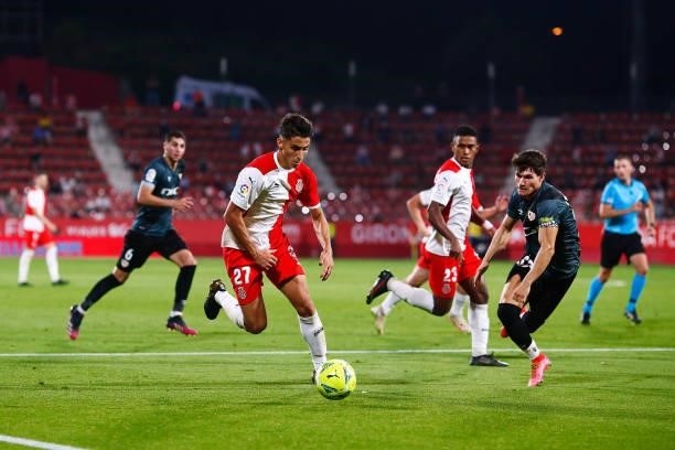 Ramon Terrats of Girona FC challenges for the ball against Fran Garcia of Rayo Vallecano during the La Liga Smartbank Playoff Final 2nd Leg match...