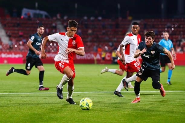 Ramon Terrats of Girona FC challenges for the ball against Fran Garcia of Rayo Vallecano during the La Liga Smartbank Playoff Final 2nd Leg match...