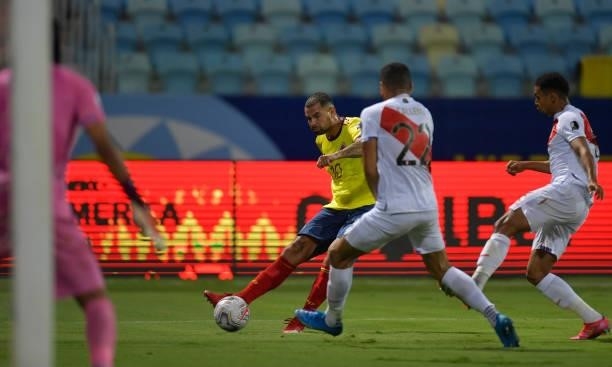 Edwin Cardona of Colombia competes for the ball with Alexander Callens of Peru during a group b match between Colombia and Peru as part of Copa...