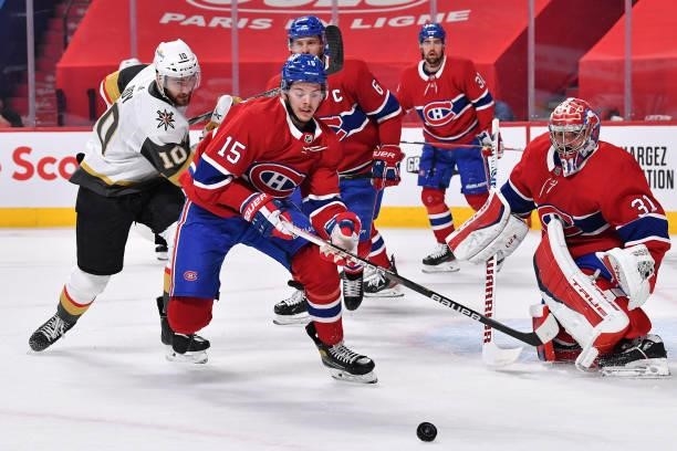 Jesperi Kotkaniemi of the Montreal Canadiens chases down the puck against Nicolas Roy of the Vegas Golden Knights during the first period in Game...