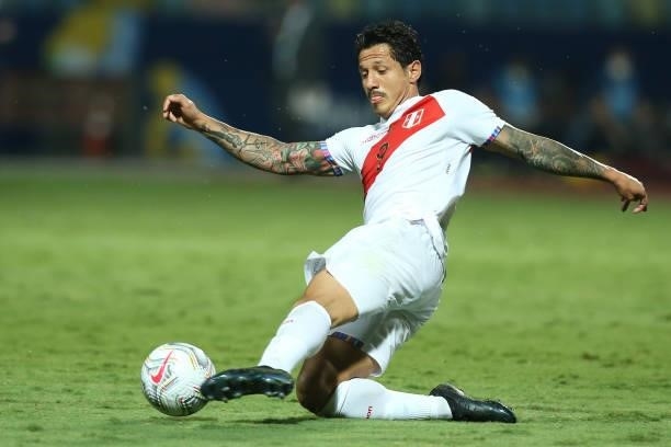 Gianluca Lapadula of Peru kicks the ball during a group b match between Colombia and Peru as part of Copa America Brazil 2021 at Estadio Olimpico on...