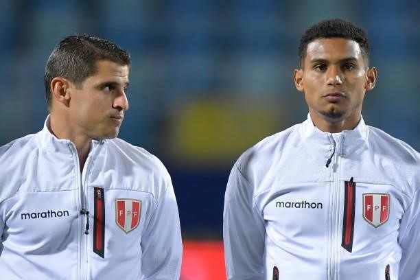 Aldo Corzo and Marcos López of Peru look on before a group b match between Colombia and Peru as part of Copa America Brazil 2021 at Estadio Olimpico...