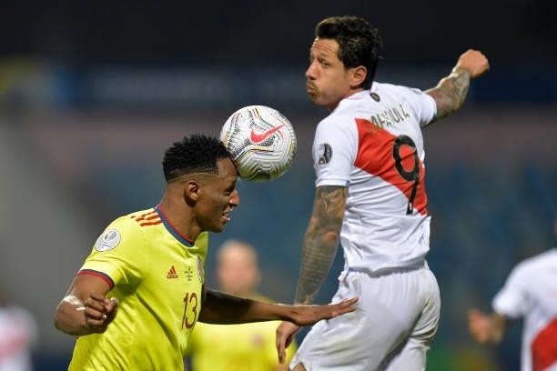 Yerry Mina of Colombia heads the ball against Gianluca Lapadula of Peru during a group B match between Colombia and Peru as part of Copa America...