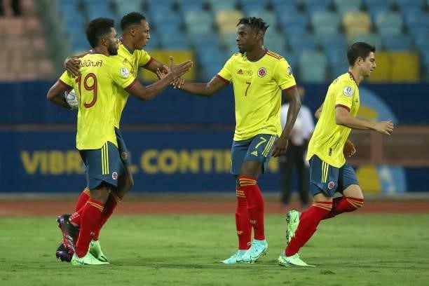 Miguel Borja of Colombia celebrates with teammates Yerry Mina, Duvan Zapata and Stefan Medina after scoring the first goal of his team during a group...