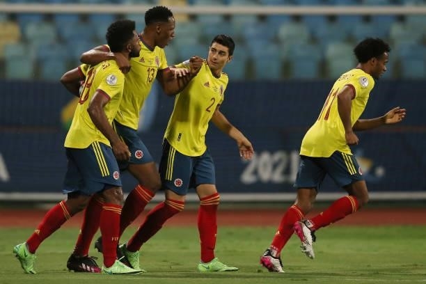 Miguel Borja of Colombia celebrates with teammates Yerry Mina, Stefan Medina and Juan Cuadrado after scoring the first goal of his team during a...