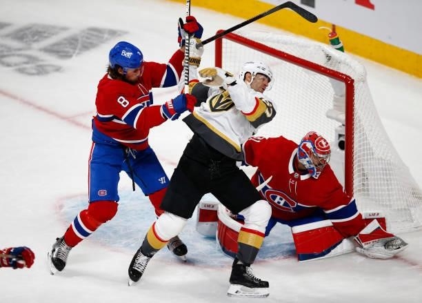 Carey Price of the Montreal Canadiens makes the save as Ben Chiarot and Max Pacioretty of the Vegas Golden Knights battle in front during the second...