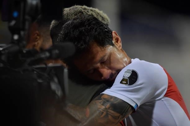 Gianluca Lapadula of Peru embraces a teammate after being replaced during a group B match between Colombia and Peru as part of Copa America Brazil...