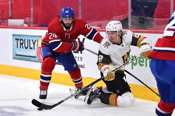 Phillip Danault of the Montreal Canadiens and Zach Whitecloud of the Vegas Golden Knights battle for the puck during the second period in Game Four...