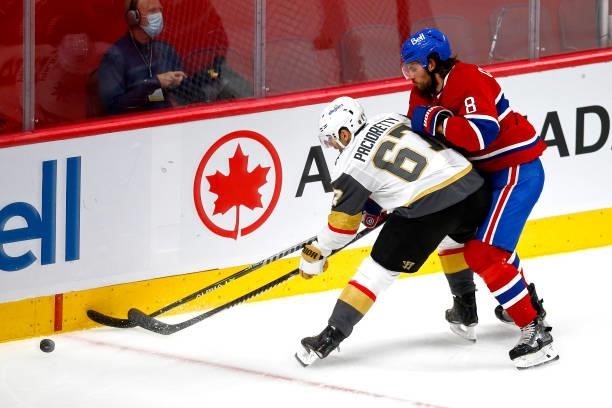 Max Pacioretty of the Vegas Golden Knights and Ben Chiarot of the Montreal Canadiens battle for the puck during the second period in Game Four of the...