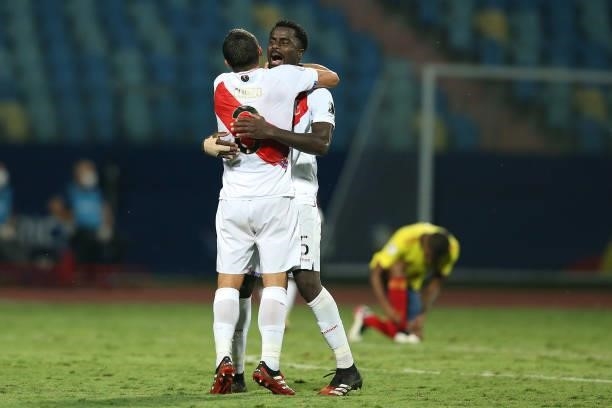 Aldo Corzo of Peru celebrates with teammate Christian Ramos after winning a group B match between Colombia and Peru as part of Copa America Brazil...