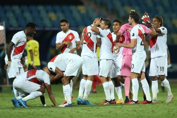 Aldo Corzo of Peru celebrates with teammate Alexander Callens after winning a group B match between Colombia and Peru as part of Copa America Brazil...