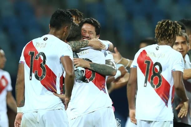 Aldo Corzo of Peru embraces with teammate Gianluca Lapadula after winning a group B match between Colombia and Peru as part of Copa America Brazil...