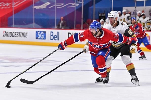 Phillip Danault of the Montreal Canadiens and Max Pacioretty of the Vegas Golden Knights battle for the puck during the second period in Game Four of...