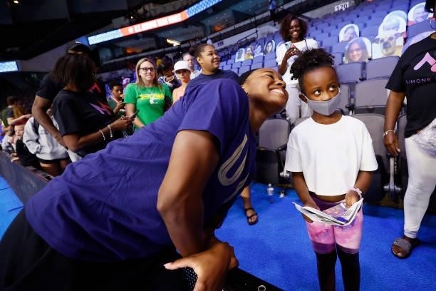 Simone Manuel of the United States takes a picture with a fan during Day Eight of the 2021 U.S. Olympic Team Swimming Trials at CHI Health Center on...