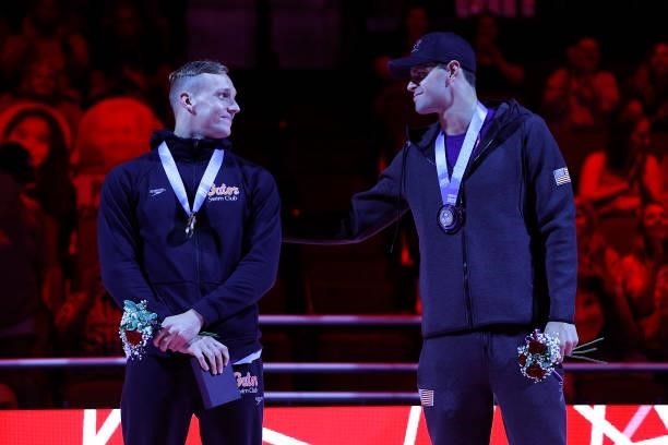 Caeleb Dressel and Michael Andrew react during the Men’s 50m freestyle medal ceremony during Day Eight of the 2021 U.S. Olympic Team Swimming Trials...