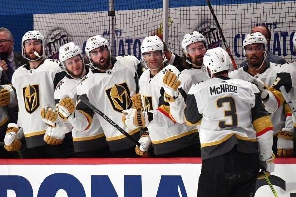 Brayden McNabb of the Vegas Golden Knights is congratulated by his teammates after scoring a goal against the Montreal Canadiens during the third...