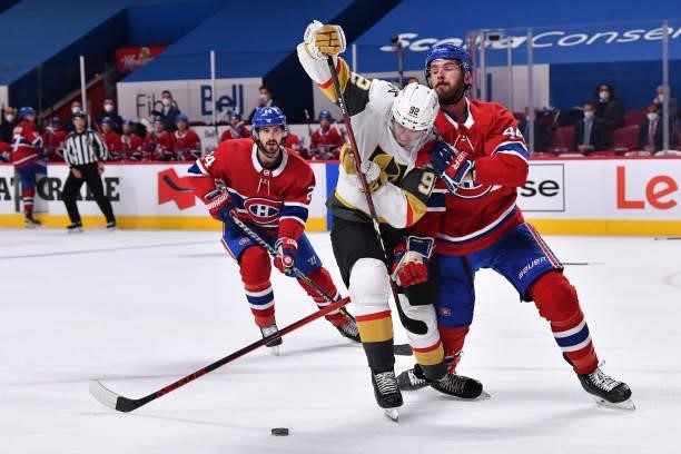 Tomas Nosek of the Vegas Golden Knights and Joel Edmundson of the Montreal Canadiens battle for the puck during the third period in Game Four of the...