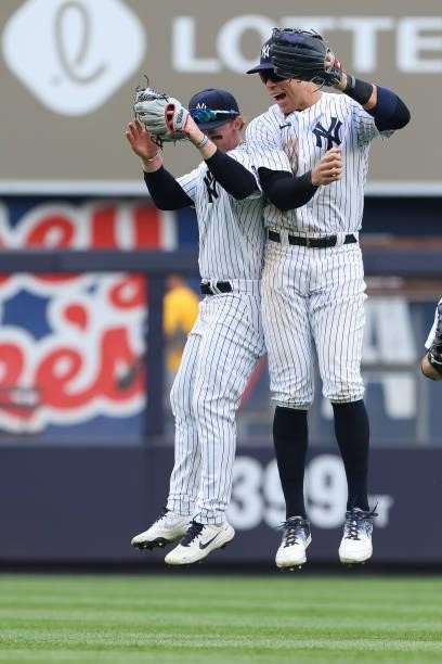 Clint Frazier and Aaron Judge of the New York Yankees celebrate after defeating the Oakland Athletics 7-5 during a game at Yankee Stadium on June 19,...