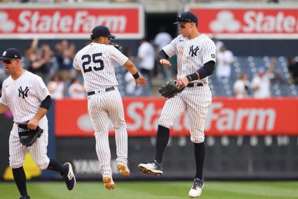 Gleyber Torres and Aaron Judge of the New York Yankees celebrate after defeating the Oakland Athletics 7-5 during a game at Yankee Stadium on June...