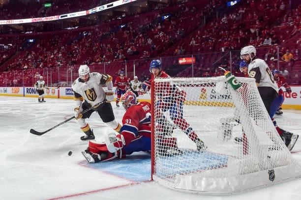Nicolas Roy of the Vegas Golden Knights scores the game-winning goal past Carey Price of the Montreal Canadiens during the first overtime period in...