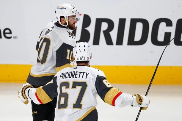 Nicolas Roy of the Vegas Golden Knights is congratulated by Max Pacioretty after scoring the game-winning goal in overtime against the Montreal...