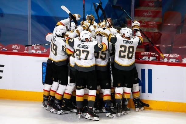 Nicolas Roy of the Vegas Golden Knights is congratulated by his teammates after scoring the game-winning goal in overtime against the Montreal...