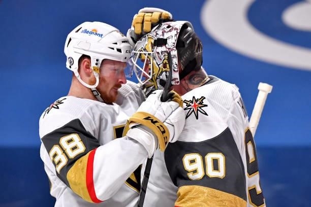 Patrick Brown and Robin Lehner of the Vegas Golden Knights celebrate their team's 2-1 overtime victory against the Montreal Canadiens in Game Four of...