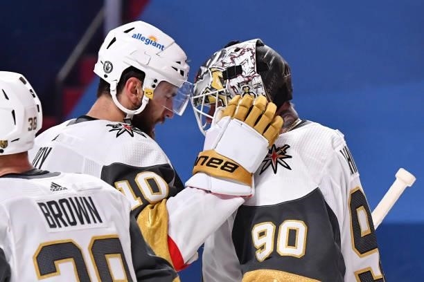 Nicolas Roy and Robin Lehner of the Vegas Golden Knights celebrate their team's 2-1 overtime victory against the Montreal Canadiens in Game Four of...