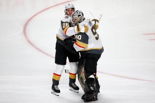 Mattias Janmark and Robin Lehner of the Vegas Golden Knights celebrate their team's 2-1 overtime victory against the Montreal Canadiens in Game Four...