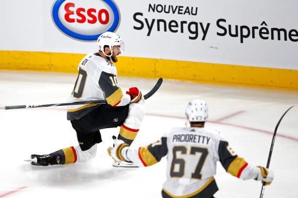 Nicolas Roy of the Vegas Golden Knights is congratulated by Max Pacioretty after scoring the game-winning goal in overtime against the Montreal...