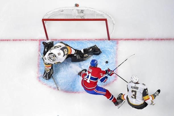 Eric Staal of the Montreal Canadiens and Brayden McNabb of the Vegas Golden Knights battle for the puck in front of Robin Lehner during the first...