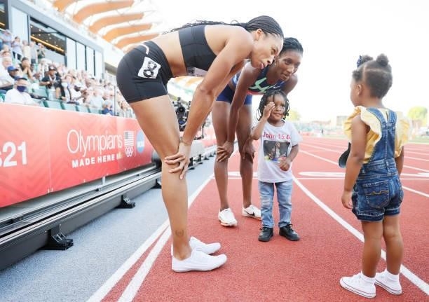 Allyson Felix and Quanera Hayes celebrate with their children after placing second and first respectively in the Women's 400 Meters Final on day...