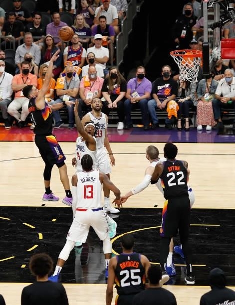 Devin Booker of the Phoenix Suns puts up a shot over Terance Mann of the LA Clippers during the second half of game one of the Western Conference...