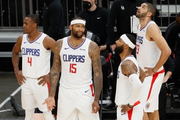 Rajon Rondo, DeMarcus Cousins, Marcus Morris Sr. #8 and Nicolas Batum of the LA Clippers react during the second half of game one of the Western...