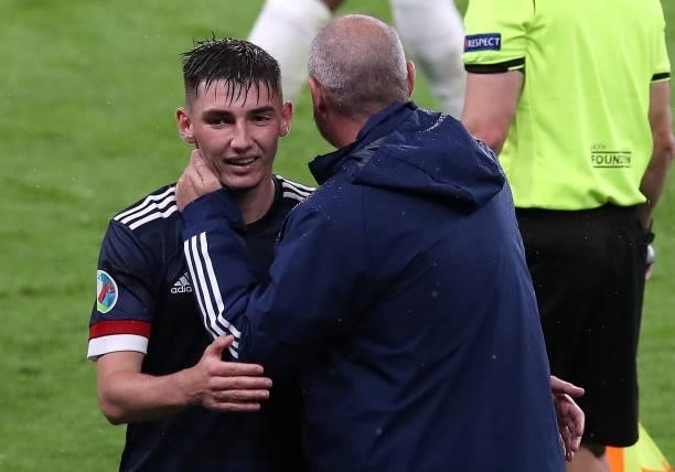 Billy Gilmour of Scotland who has just tested positive with COVID19 is seen here with Scotland manager Steve Clarke after being substituted during...