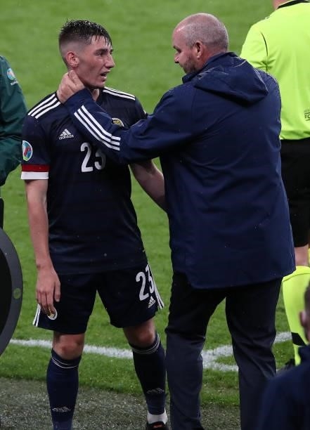 Billy Gilmour of Scotland who has just tested positive with COVID19 is seen here with Scotland manager Steve Clarke after being substituted during...